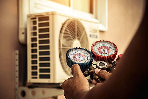 Professional Heat Pump Repair technician working in Slinger, WI